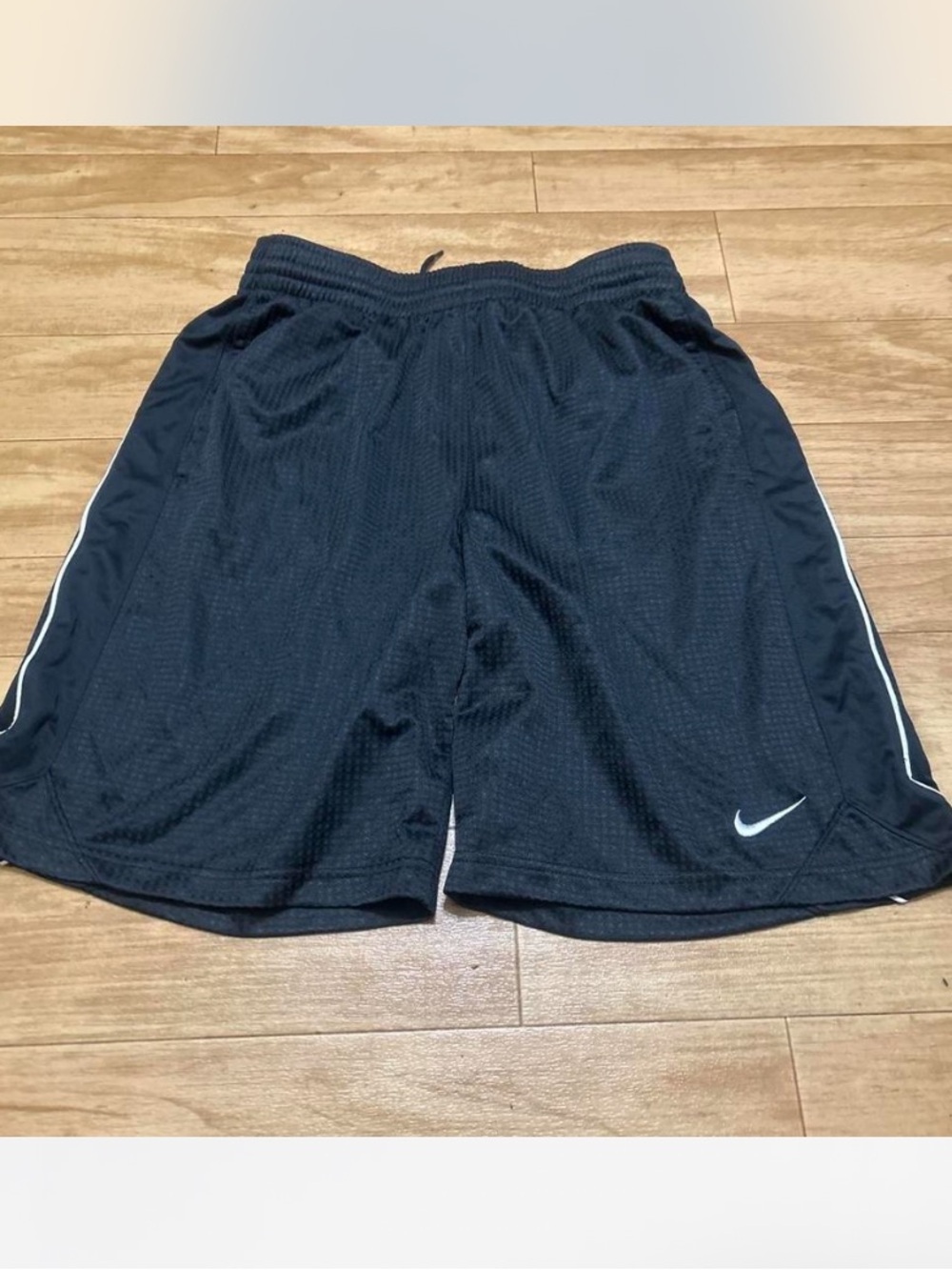 Nike Black Mesh Athletic Shorts with White Swoosh